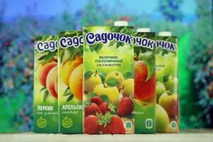 KHARKIV, UKRAINE - JANUARY 2, 2021 Sadochok various taste nectar from peach, apple and strawberry with orange flavour juice photo