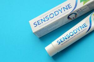 KYIV, UKRAINE - MAY 4, 2022 Sensodyne fluorine or fluor is a daily fluoride toothpaste photo