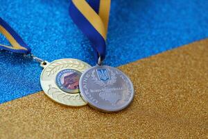 KYIV, UKRAINE - MAY 4, 2022 Medal for the person who conquered Mount Hoverla photo