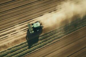 AI generated Combine harvester working on the large wheat field. Combine harvester working on the large wheat field, Aerial view of a Tractor fertilizing a cultivated agricultural field, AI Generated photo