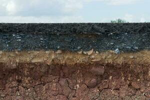 Layers of road with soil and rock. photo