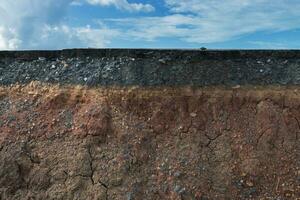 Layers of road with soil and rock. photo