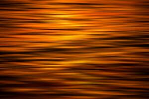 Abstact background from water surface with light of sunset. photo