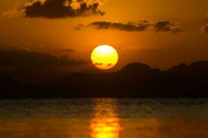 Sunset at the lake in summer season. photo