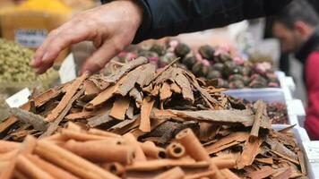 closeup of Cinnamon sticks selling at spice bazar video