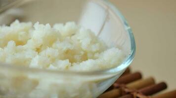 close up of minced garlic on a wooden spoon video