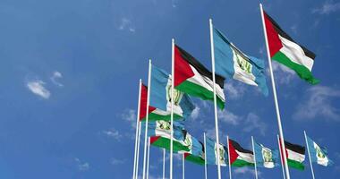 Guatemala and Palestine Flags Waving Together in the Sky, Seamless Loop in Wind, Space on Left Side for Design or Information, 3D Rendering video