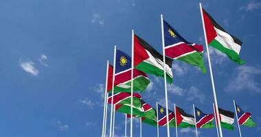 Namibia and Palestine Flags Waving Together in the Sky, Seamless Loop in Wind, Space on Left Side for Design or Information, 3D Rendering video