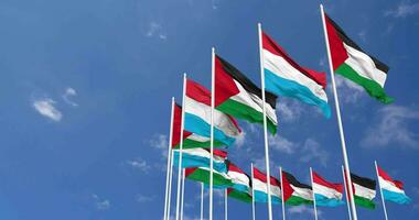 Luxembourg and Palestine Flags Waving Together in the Sky, Seamless Loop in Wind, Space on Left Side for Design or Information, 3D Rendering video