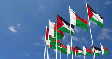 Madagascar y Palestina banderas ondulación juntos en el cielo, sin costura lazo en viento, espacio en izquierda lado para diseño o información, 3d representación video