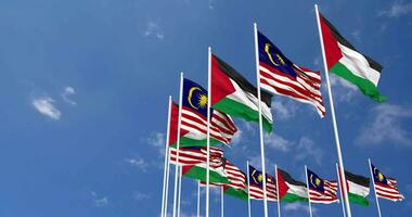 Malaysia and Palestine Flags Waving Together in the Sky, Seamless Loop in Wind, Space on Left Side for Design or Information, 3D Rendering video