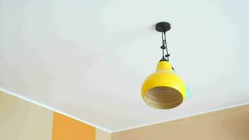 colorful ceiling lamp hanging in a room , video