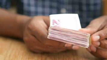 Close up of man hand counting 100 us dollar cash video