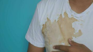 men showing making stain on dirty shirt video