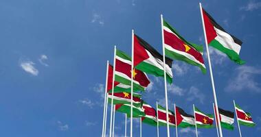 Suriname and Palestine Flags Waving Together in the Sky, Seamless Loop in Wind, Space on Left Side for Design or Information, 3D Rendering video