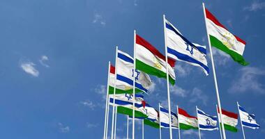 Tajikistan and Israel Flags Waving Together in the Sky, Seamless Loop in Wind, Space on Left Side for Design or Information, 3D Rendering video