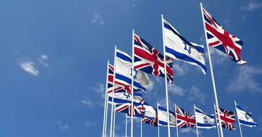 United Kingdom and Israel Flags Waving Together in the Sky, Seamless Loop in Wind, Space on Left Side for Design or Information, 3D Rendering video