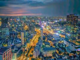 Beautiful Ho Chi Minh Saigon aerial view with buildings and river by sunset photo