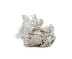 Single screwed or crumpled tissue paper or napkin in strange shape after use in toilet or restroom isolated on white background with clipping path photo