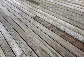 Natural grey surface from wood boards. Decking tiles. Horizontal view photo