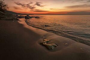 Awakening. An incredible feeling at the beach of the sea in anticipation of sunrise photo