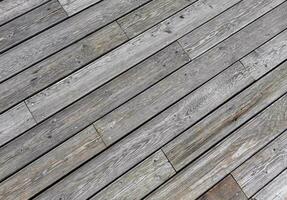 Natural grey surface from wood boards. Decking tiles. Horizontal view photo