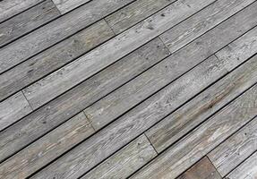 Natural grey surface from wood boards. Decking tiles. Horizontal view photo