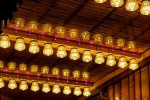 festive lighting on a wooden ceiling photo