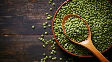 AI generated Close-up view of a bowl of green lentils with a spoon, set against a dark wooden background. With copy space. Banner. Suitable for cooking and recipe related content photo