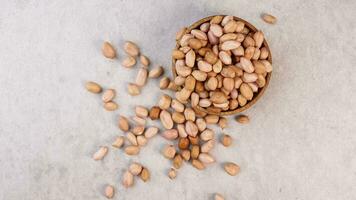 Organic Roasted Peanuts. Isolated Nut Snack Concept. Healthy, Delicious, and Crunchy Seeds photo