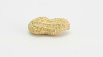 Organic Roasted Peanuts. Isolated Nut Snack Concept. Healthy, Delicious, and Crunchy Seeds photo
