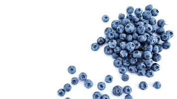 Fresh Blueberries. Organic, Juicy and Nutritious Fruit Isolated on White Background. Healthy Snacks Concept and Antioxidant-Rich Nutrition photo