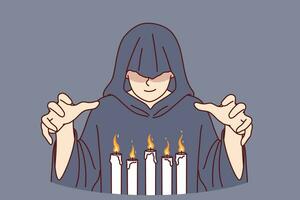 Man monk in hood stands over burning candles, performing mysterious religious ritual to communicate with otherworldly world. Monk experiments with black magic and practices witchcraft vector