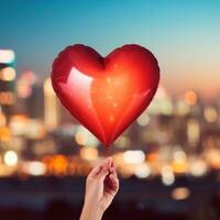 AI generated Hand holding heart-shaped balloon against blurred city lights photo