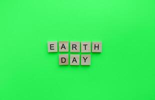 March 20, Earth day, a minimalistic banner with an inscription in wooden letters photo