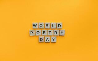 March 21, World Poetry Day, minimalistic banner with wooden lettering photo