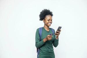 beautiful African lady using her phone and card photo