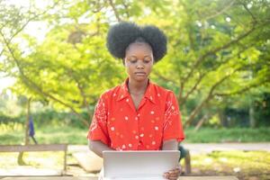 Teen girl studying with a laptop outdoor photo