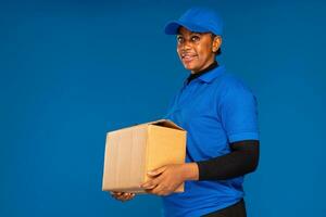 beautiful african delivery woman holding a package photo