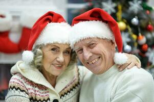 Hugging senior couple smile on blurred background photo