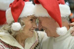 Hugging senior couple smile on blurred background photo