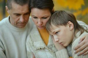 Portrait of a family of three on the nature photo