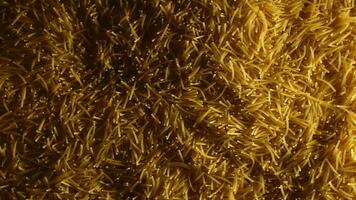 Background of Uncooked Noodles that Slowly Rotating Counterclockwise Top View. Texture of Dry Vermicelli Turning Around. Raw Pasta with Low Key Light Left Rotation video