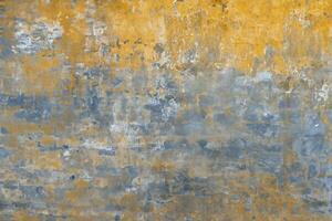 Background of old yellow painted wall texture photo