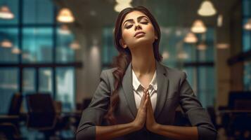 AI generated a woman dressed in a business suit, likely an office worker, praying or meditating with her hands clasped together. She appears to be in a contemplative and serene state, seeking inner peace and balance amidst her professional life. photo