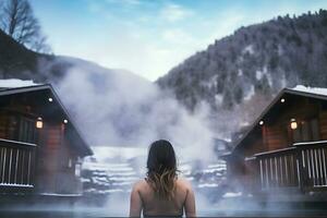 ai generado un niña nada con su espalda a el cámara en un caliente térmico primavera en el hotel jardines en el medio de un Nevado bosque y montañas. viaje concepto a caliente muelles en invierno foto