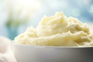 AI generated Creamy mashed potatoes in white bowl in white kitchen. Healthy food. Generative AI photo