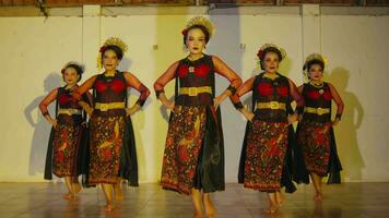 a group of Sundanese dancers walk with their friends to a stage before the dance performance begins video