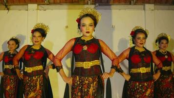 a group of Sundanese dancers walk with their friends to a stage before the dance performance begins video