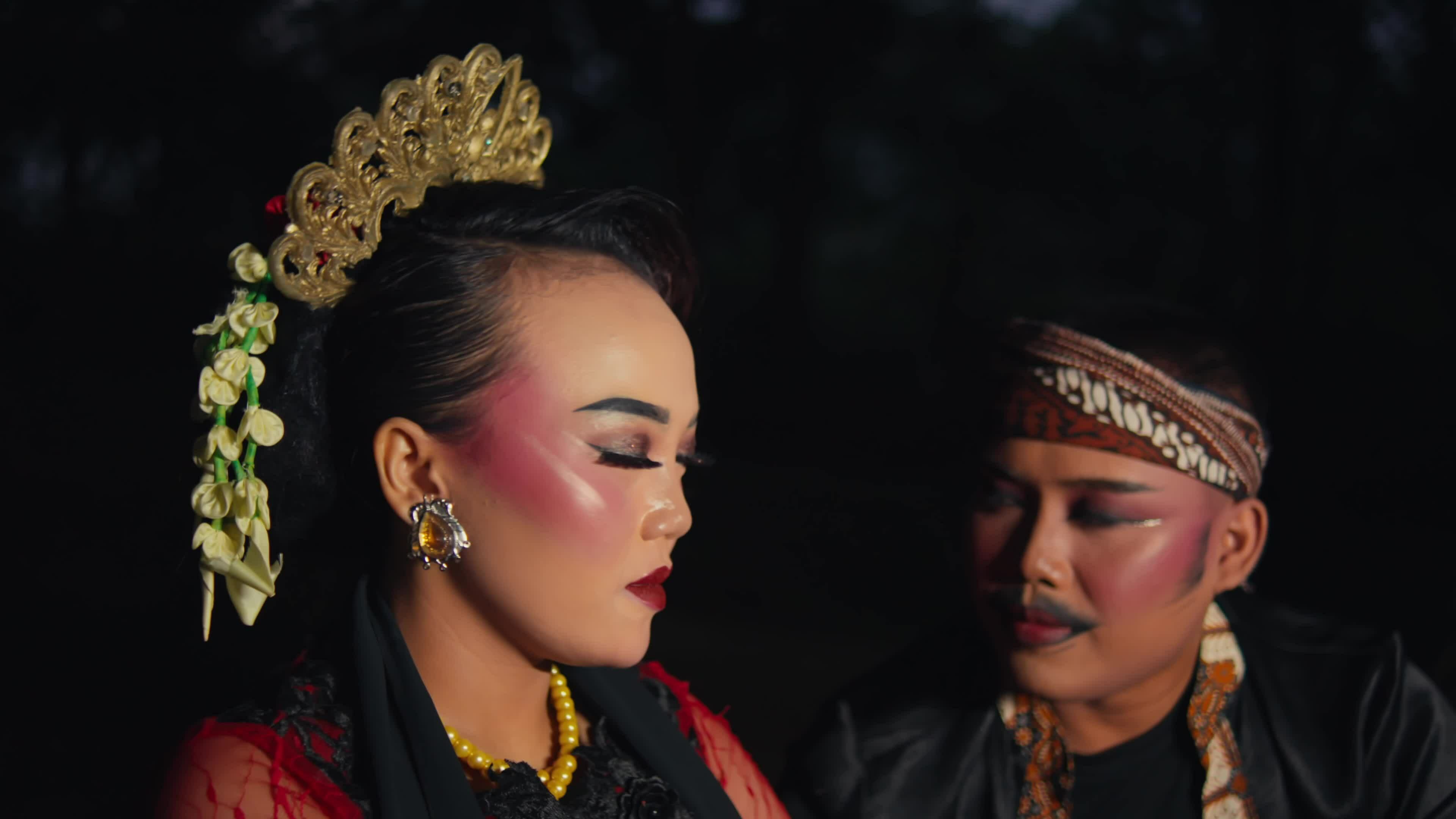 an Asian man is courting a woman very passionately using flowers an Asian man is courting a woman very passionately using flowers